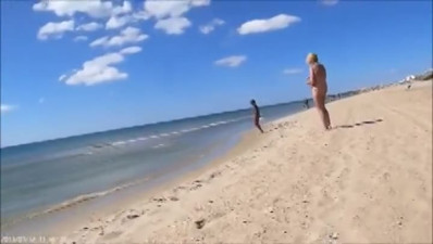 Young & naked MILF shared at the beach